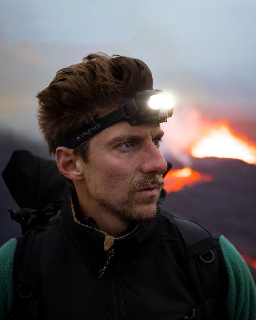 Black Coloured Led Lenser HF4R Core Rechargeable Head Torch on blurry background #colour_black