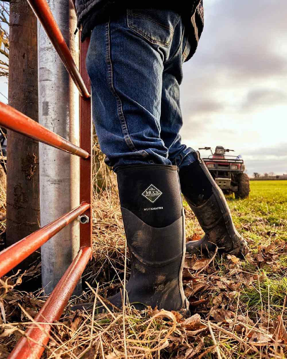 Black Coloured Muck Boots Muckmaster Tall Boot on farm background #colour_black