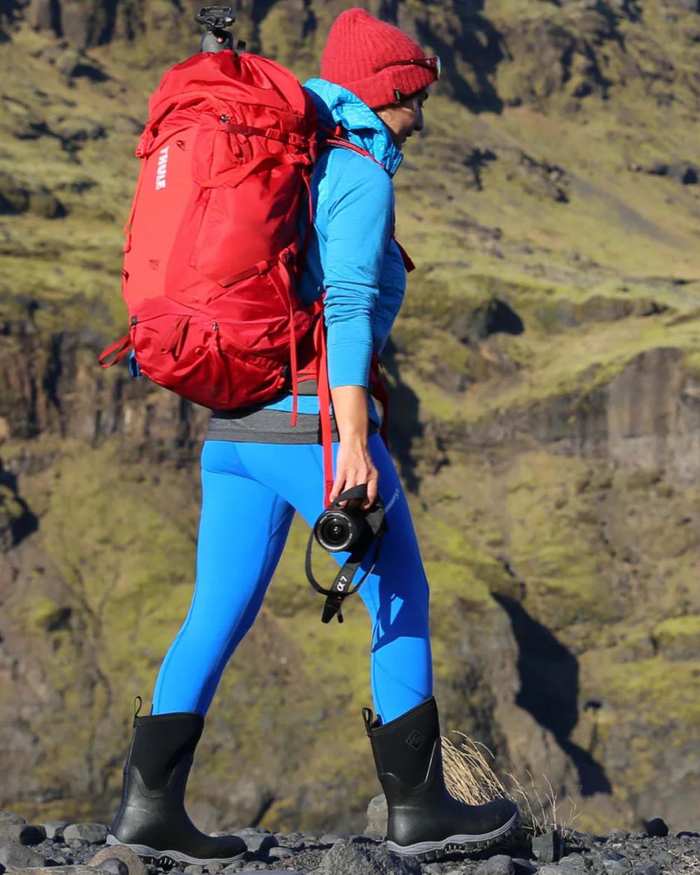 Black Coloured Muck Boots Womens Arctic Sport II Mid Wellingtons On A Mountain Background #colour_black