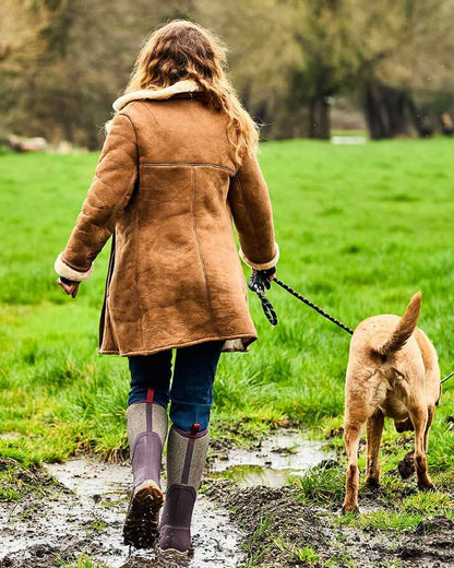 Wine Herringbone Print Coloured Muck Boots Womens Arctic Sport II Tall Wellingtons on countryside background #colour_wine-herringbone-print