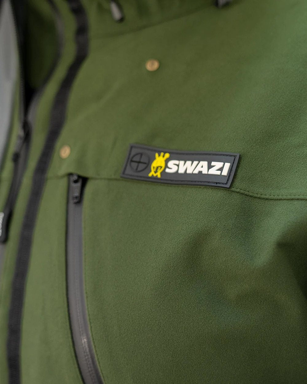 Olive Coloured Swazi Kagoule Jacket On A White Background #colour_olive