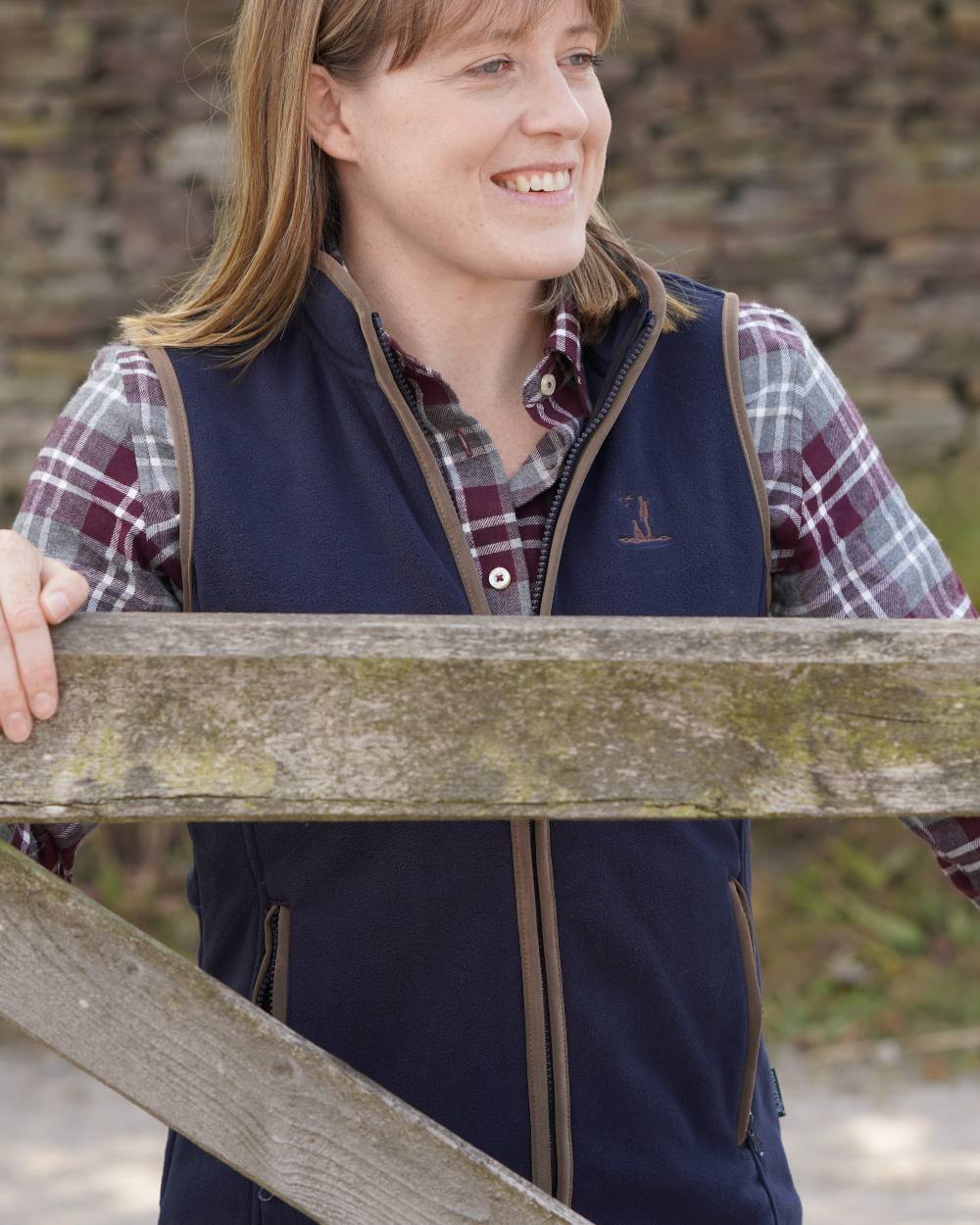 Navy coloured Percussion Ladies Scotland Fleece Gilet on farm background #colour_navy