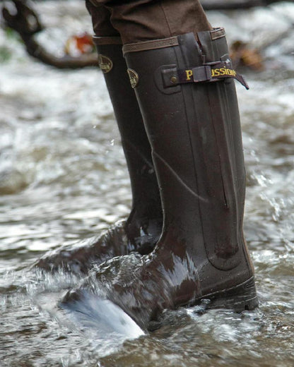 Brown coloured Percussion Rambouillet Full Zip Wellington Boots on water background #colour_brown