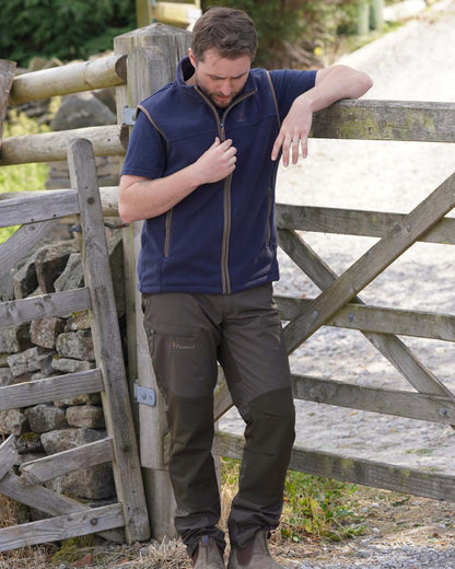 Navy coloured Percussion Scotland Fleece Gilet on farm background #colour_navy