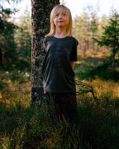 Dusty Plum Jungle coloured Pinewood Childrens Lappland Camou Trousers on forest background #colour_dusty-plum-jungle