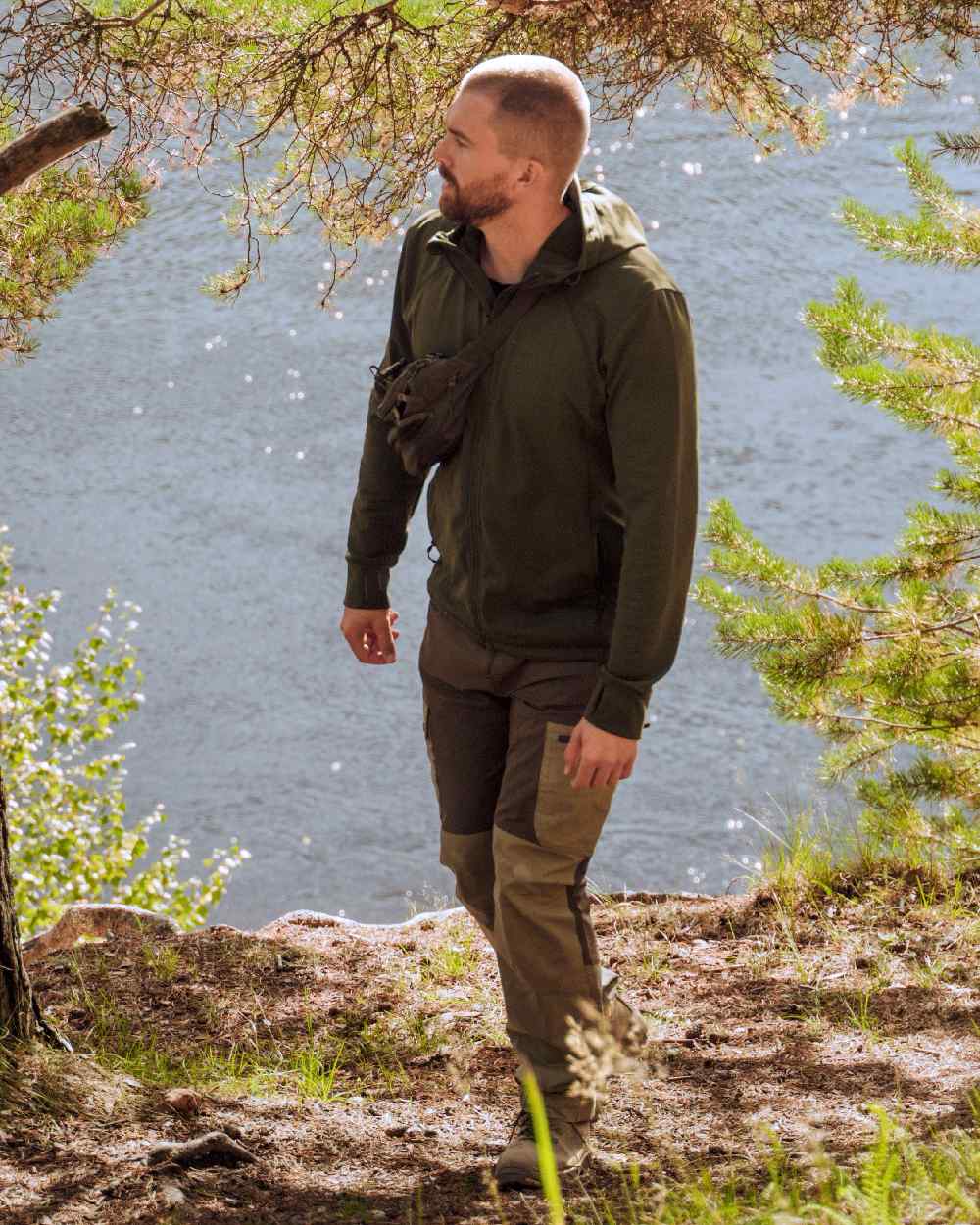 Moss Green Coloured Pinewood Finnveden Hoodie on outdoor background #colour_moss-green