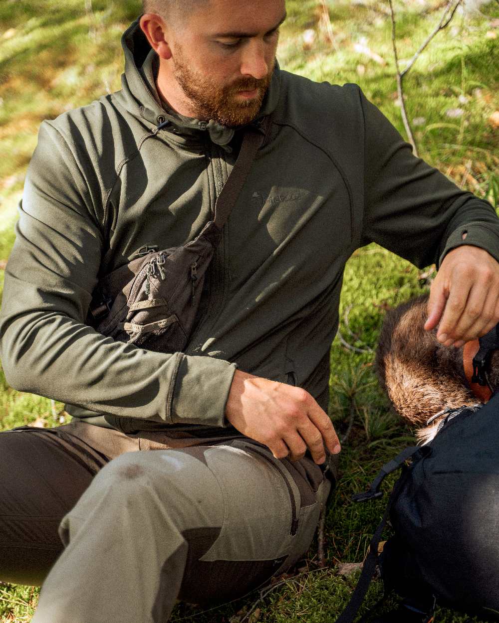 Moss Green Coloured Pinewood Finnveden Hoodie on outdoor background #colour_moss-green