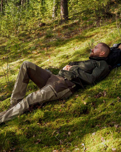Moss Green Coloured Pinewood Finnveden Hoodie on outdoor background #colour_moss-green