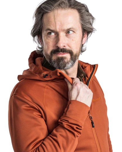 Terracotta coloured Pinewood Finnveden Hoodie on white background #colour_terracotta