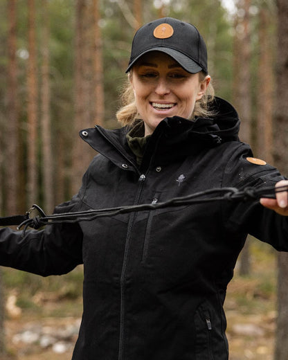 Black Coloured Pinewood Finnveden Hybrid Cap on outdoor background #colour_black