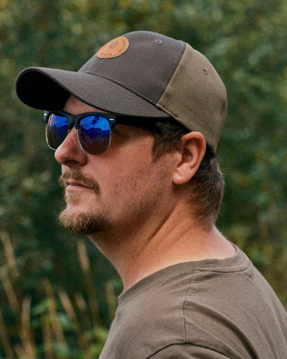 Dark Olive Hunting Olive Coloured Pinewood Finnveden Hybrid Cap on outdoor background #colour_dark-olive-hunting-olive
