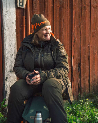 Green Orange Coloured Pinewood Melange Hat on outdoor background #colour_green-orange