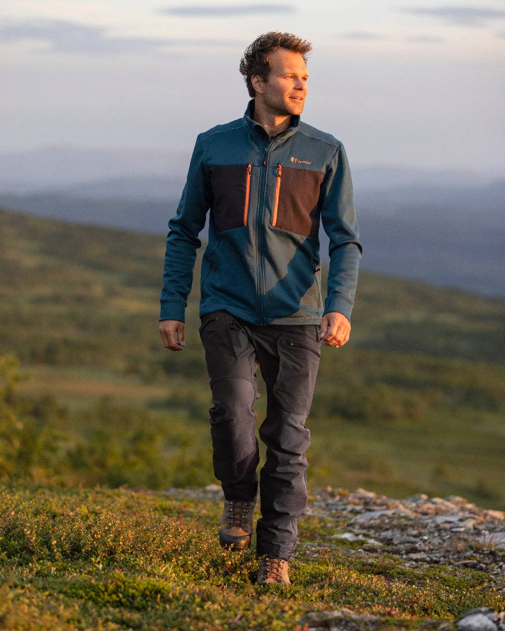 Black Coloured Pinewood Mens Abisko Adventure Trousers on outdoor background #colour_black