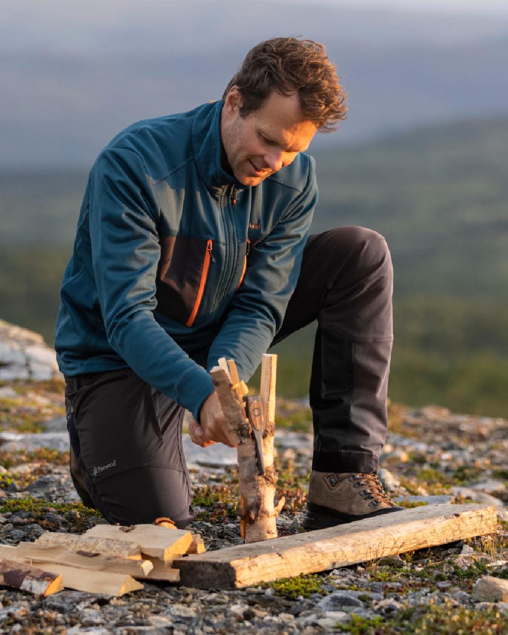 Black Coloured Pinewood Mens Abisko Adventure Trousers on outdoor background #colour_black