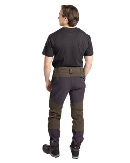 Moss Green Coloured Pinewood Mens Abisko Adventure Trousers on white background #colour_moss-green