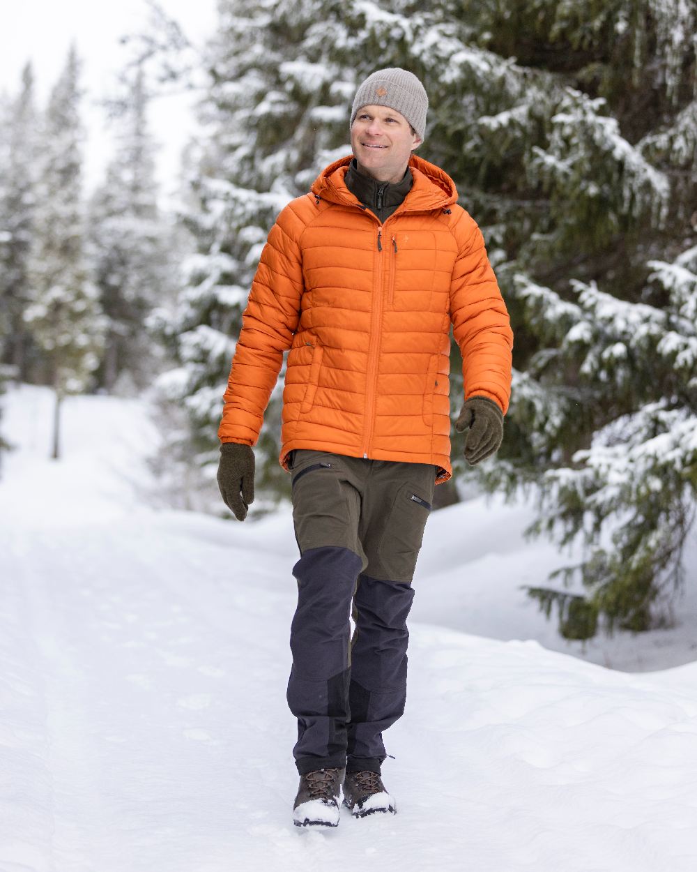 Moss Green Coloured Pinewood Mens Abisko Adventure Trousers on snow background #colour_moss-green