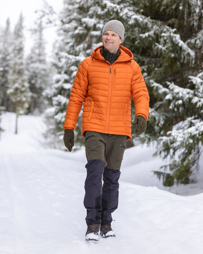 Moss Green Coloured Pinewood Mens Abisko Adventure Trousers on snow background #colour_moss-green