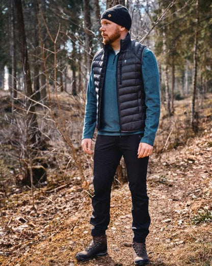 Black Coloured Pinewood Mens Abisko Brenton Trousers on outdoor background #colour_black