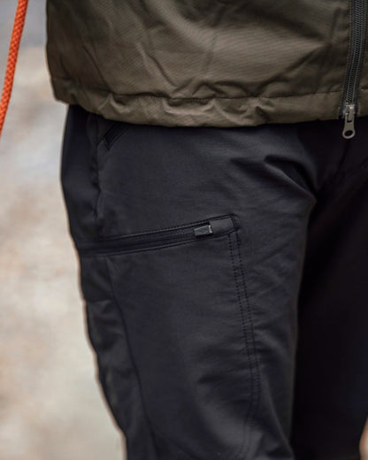 Black Coloured Pinewood Mens Abisko Brenton Trousers on outdoor background #colour_black