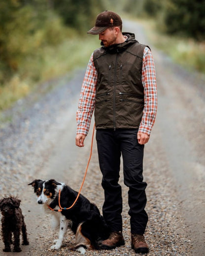 Black Coloured Pinewood Mens Abisko Brenton Trousers on outdoor background #colour_black
