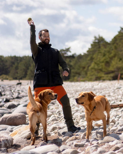 Burned Orange Mossgreen Coloured Pinewood Mens Abisko Brenton Trousers on outdoor background #colour_burned-orange-mossgreen