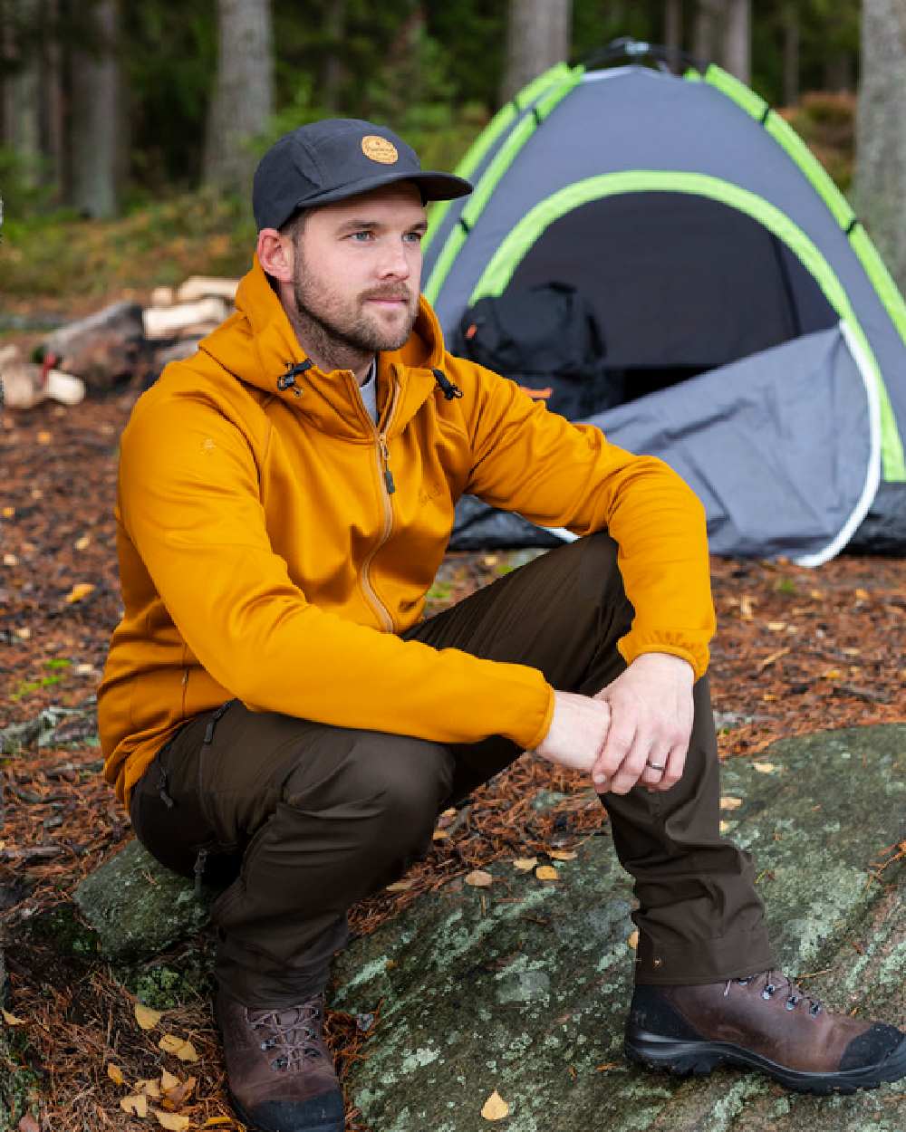 Dark Olive Suede Brown Coloured Pinewood Mens Abisko Brenton Trousers on forest background #colour_dark-olive-suede-brown