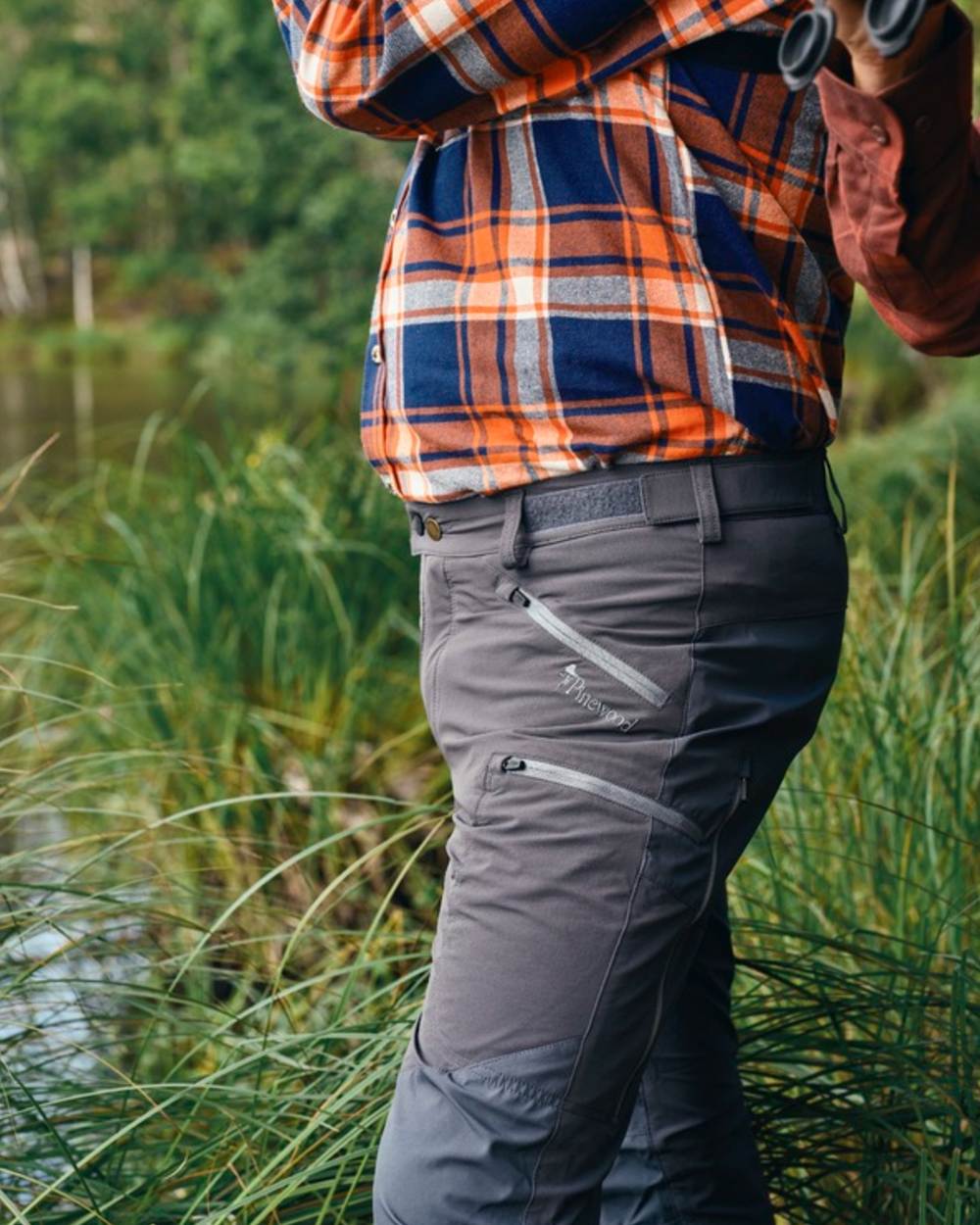 Indigo Blue Coloured Pinewood Mens Abisko Brenton Trousers on forest background #colour_indigo-blue