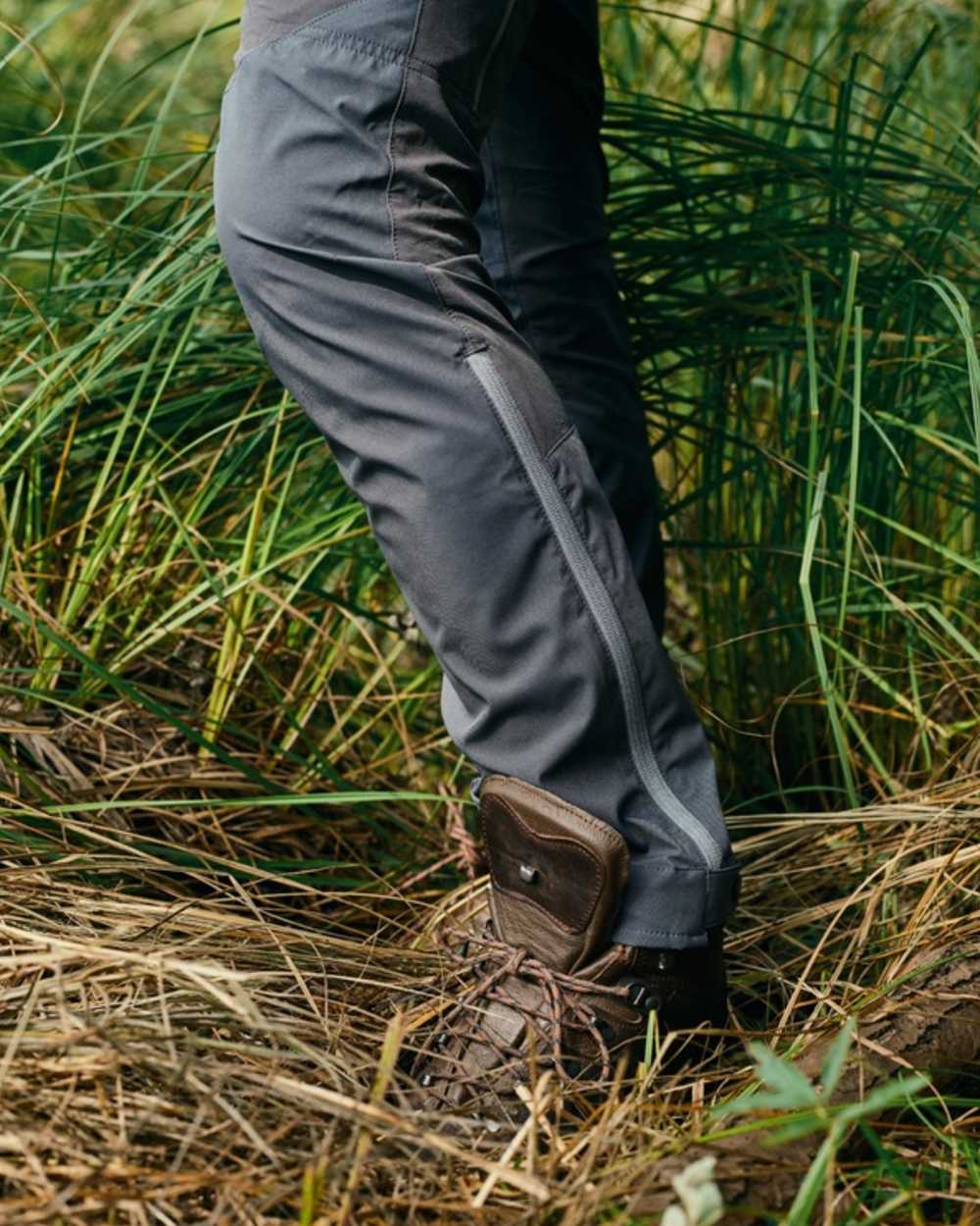 Indigo Blue Coloured Pinewood Mens Abisko Brenton Trousers on forest background #colour_indigo-blue