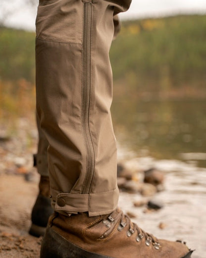Mole Brown Coloured Pinewood Mens Abisko Brenton Trousers on forest background #colour_mole-brown