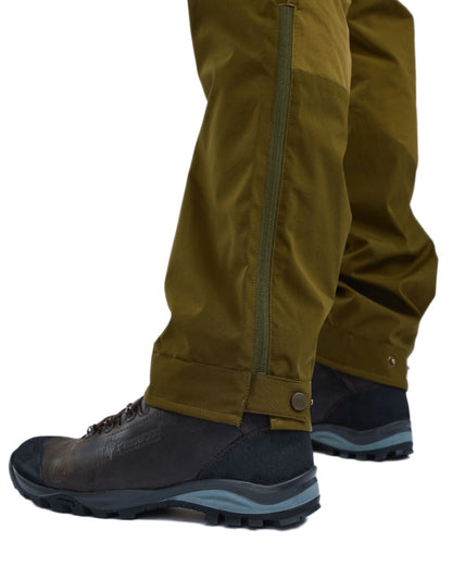 Olive Green Hunting Olive Coloured Pinewood Mens Abisko Brenton Trousers on white background #colour_olive-green-hunting-olive
