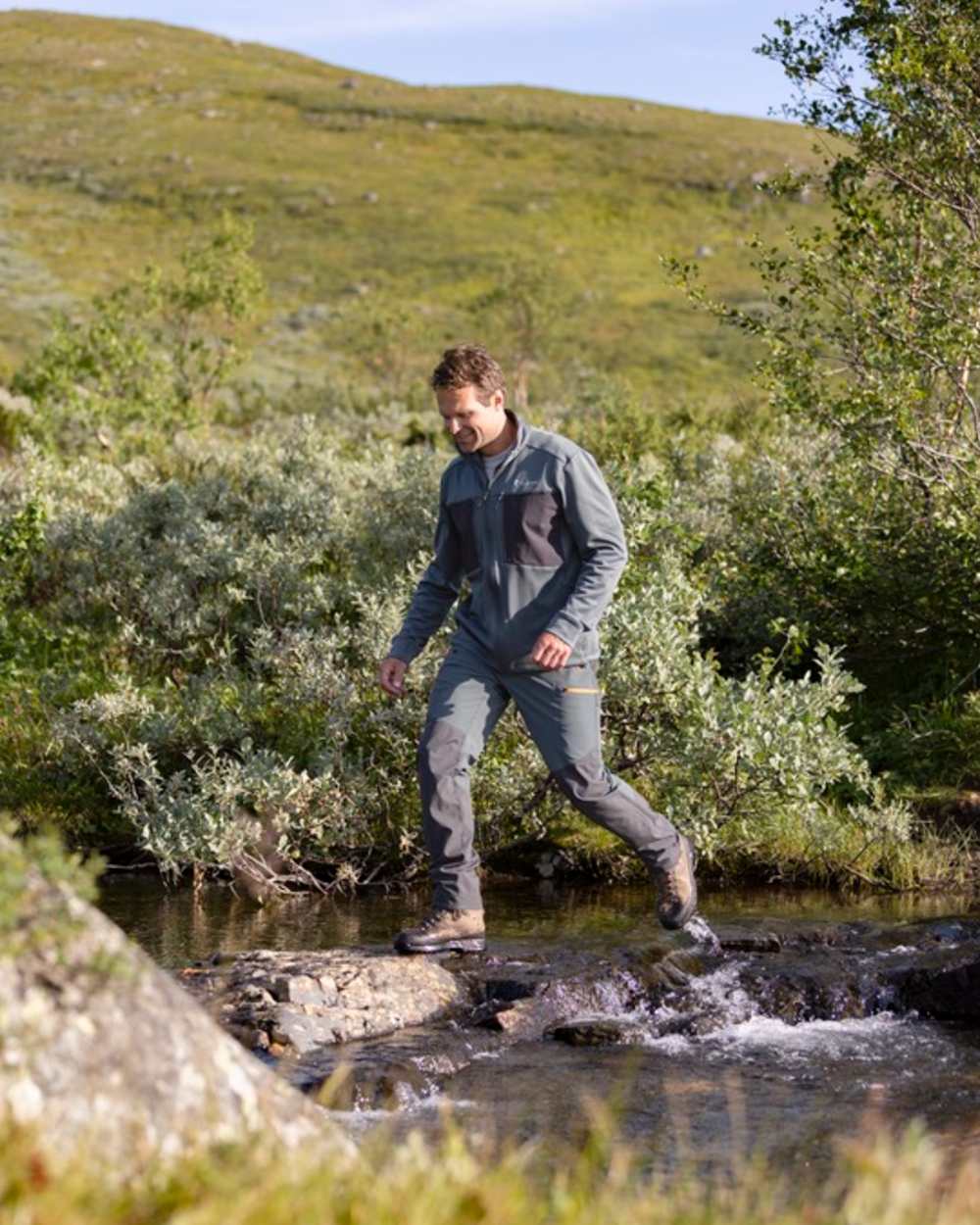 Urban Grey Dark Anthracite Coloured Pinewood Mens Abisko Brenton Trousers on forest background #colour_urban-grey-dark-anthracite