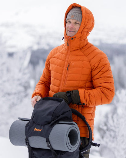 Burned Orange Coloured Pinewood Mens Abisko Insulation Jacket on snow background #colour_burned-orange