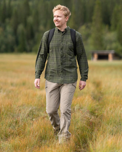 Mole Brown Coloured Pinewood Mens Abisko Light Stretch Trousers on outdoor background #colour_mole-brown