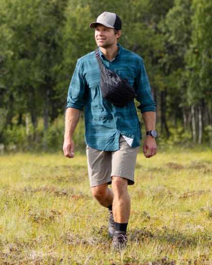 Teal Blue Coloured Pinewood Mens Abisko Trekking Long Sleeve Shirt on outdoor background #colour_teal-blue