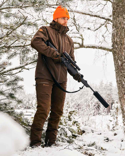 Suede Brown Dark Olive Coloured Pinewood Mens Caribou Hunt Extreme Trousers on snow background #colour_suede-brown-dark-olive