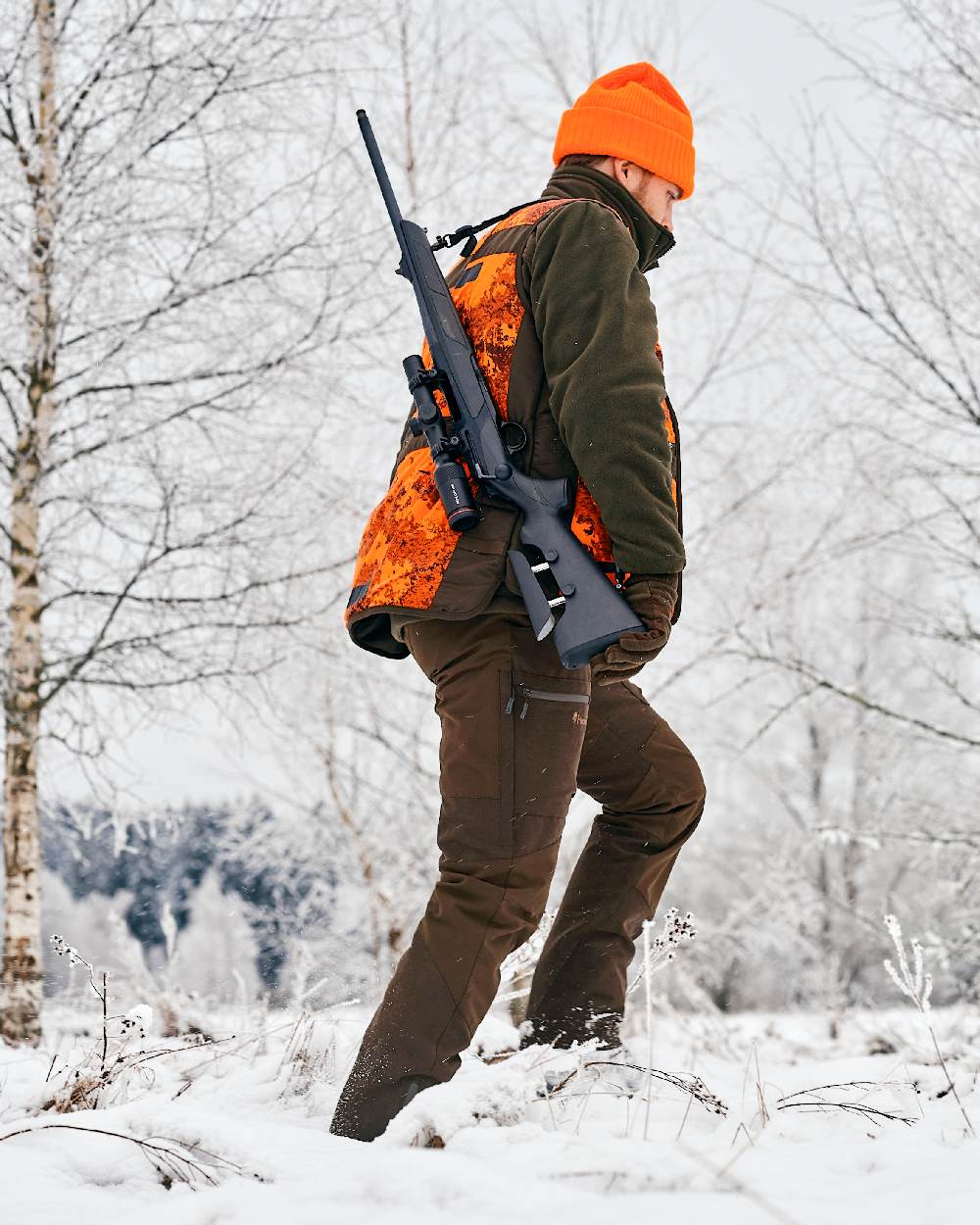 Suede Brown Dark Olive Coloured Pinewood Mens Caribou Hunt Extreme Trousers on snow background #colour_suede-brown-dark-olive