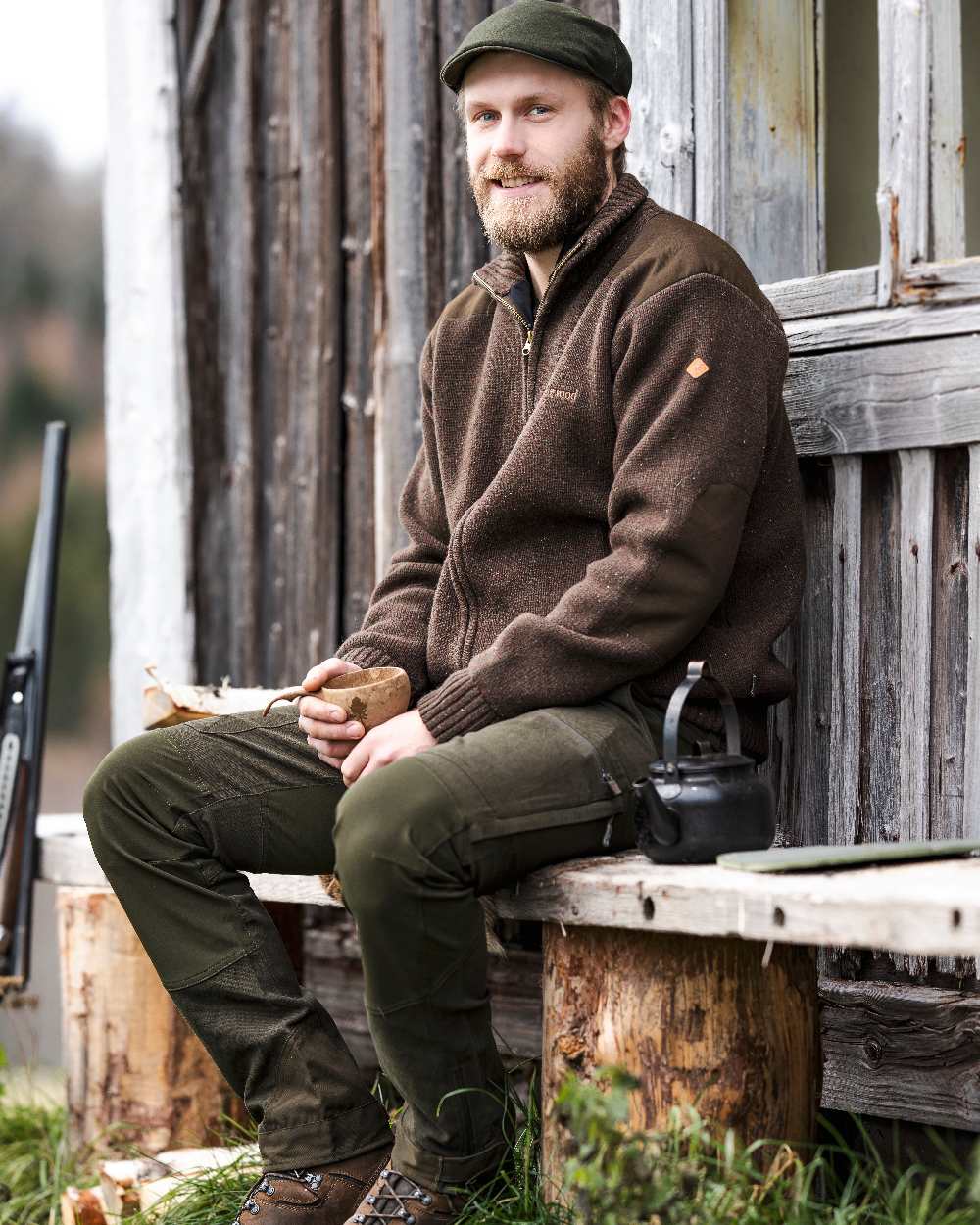 Dark Mossgreen Coloured Pinewood Mens Caribou Hunting Trousers on outdoor background #colour_dark-mossgreen