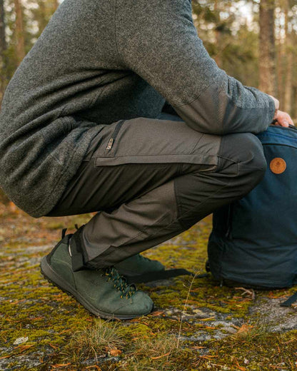 Dark Anthracite Black Coloured Pinewood Mens Caribou TC-Lite Trousers on outdoor background #colour_dark-anthracite-black