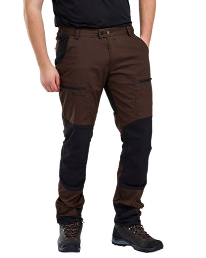 Dark Brown Black Coloured Pinewood Mens Caribou TC-Lite Trousers on white background #colour_dark-brown-black