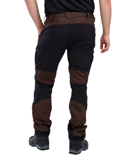 Dark Brown Black Coloured Pinewood Mens Caribou TC-Lite Trousers on white background #colour_dark-brown-black