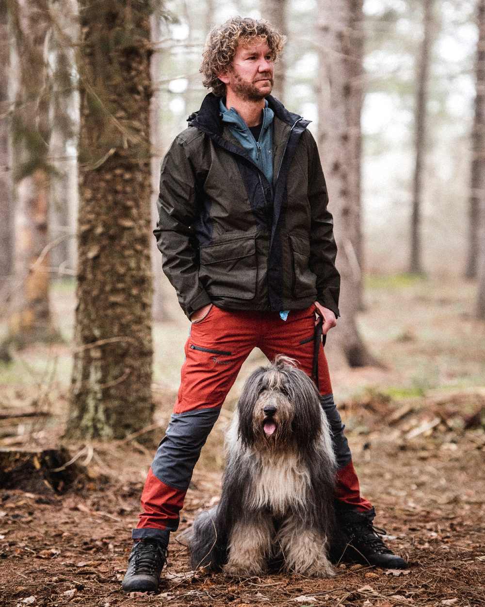 Terracotta Grey Coloured Pinewood Mens Caribou TC-Lite Trousers on outdoor background #colour_terracotta-grey