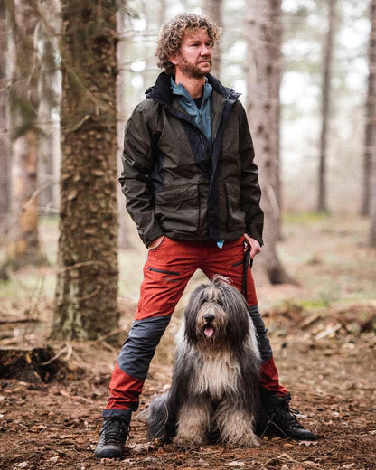 Terracotta Grey Coloured Pinewood Mens Caribou TC-Lite Trousers on outdoor background #colour_terracotta-grey