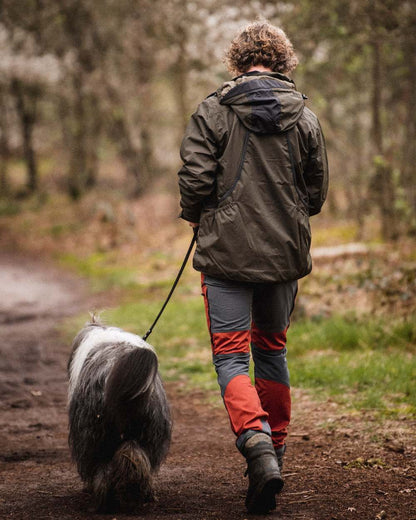 Terracotta Grey Coloured Pinewood Mens Caribou TC-Lite Trousers on outdoor background #colour_terracotta-grey