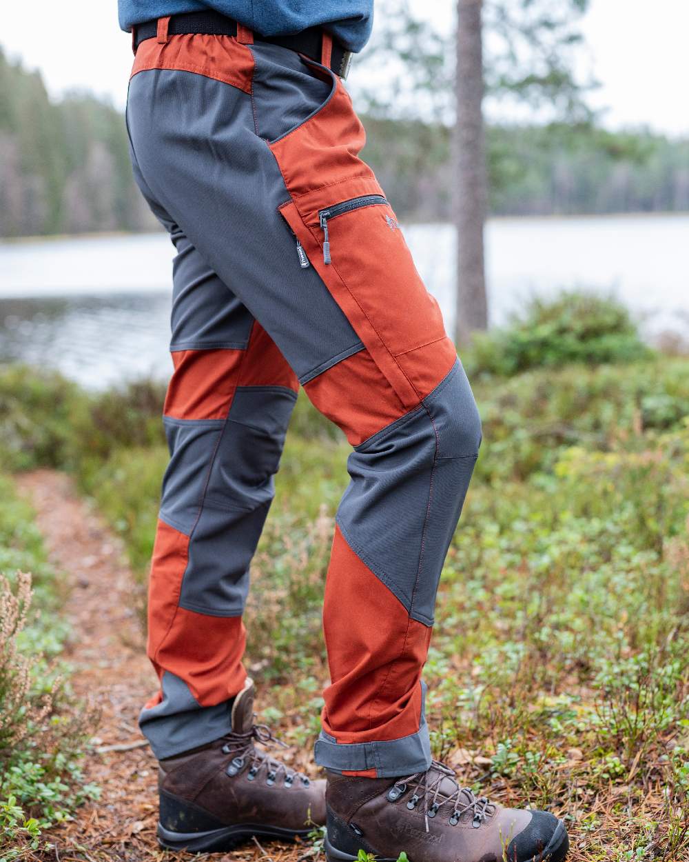 Terracotta Grey Coloured Pinewood Mens Caribou TC-Lite Trousers on outdoor background #colour_terracotta-grey
