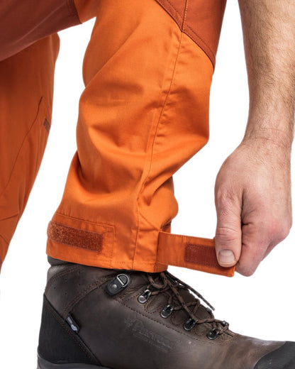 Burned Orange Terracotta Coloured Pinewood Mens Caribou TC Trousers on white background #colour_burned-orange-terracotta