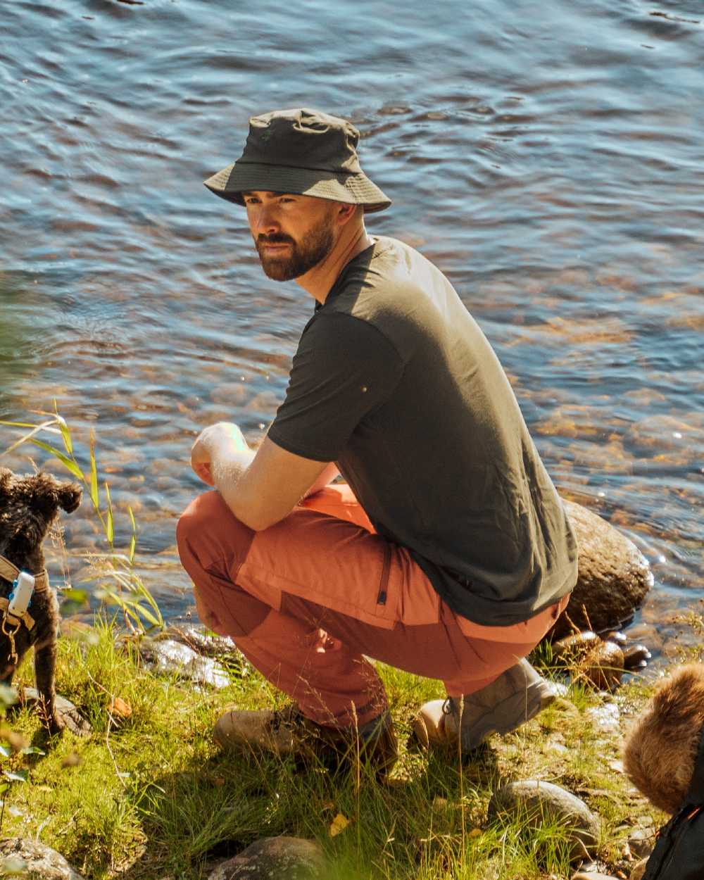 Burned Orange Terracotta Coloured Pinewood Mens Caribou TC Trousers on lake background #colour_burned-orange-terracotta