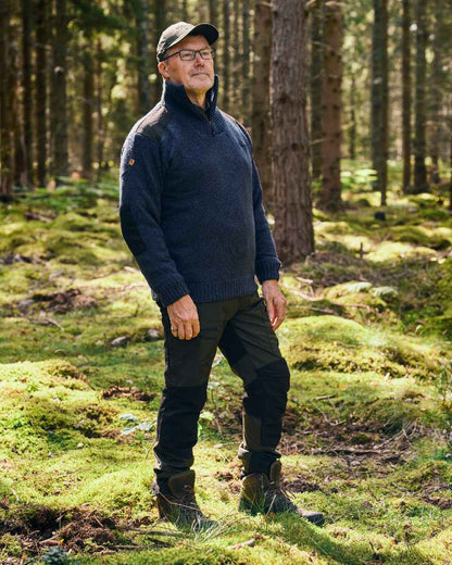 Moss Green Black Coloured Pinewood Mens Caribou Tc Extreme Trousers on forest background #colour_moss-green-black