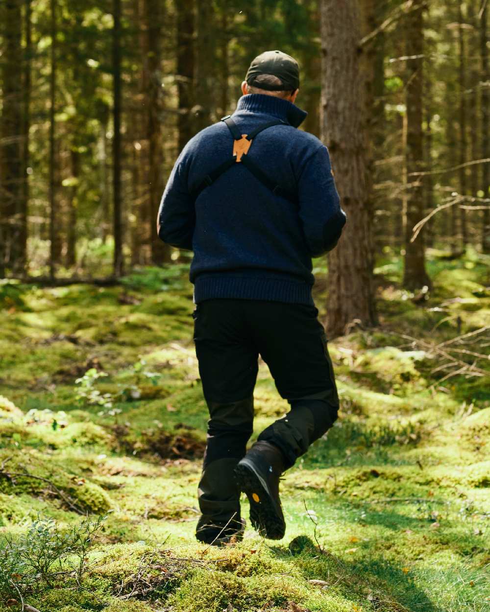 Moss Green Black Coloured Pinewood Mens Caribou Tc Extreme Trousers on forest background #colour_moss-green-black