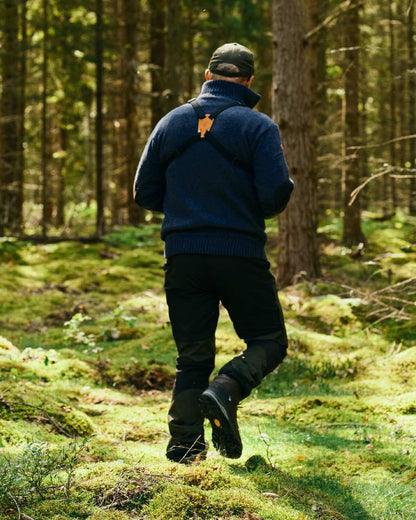 Moss Green Black Coloured Pinewood Mens Caribou Tc Extreme Trousers on forest background #colour_moss-green-black