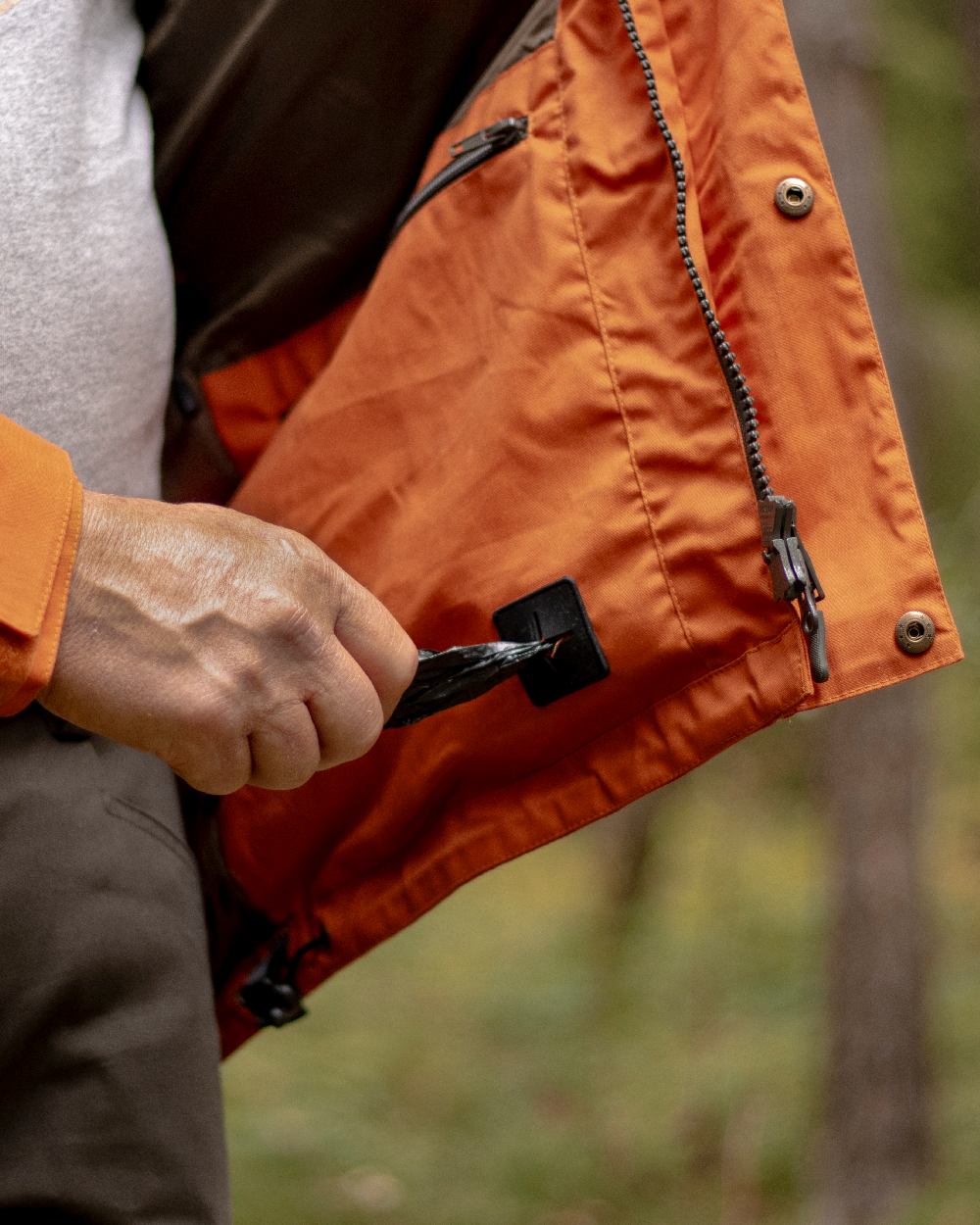 Burned Orange Coloured Pinewood Mens Dog Sports Trainer Jacket on outdoor background #colour_burned-orange